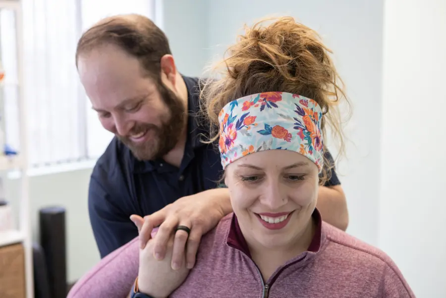 Dr. Scott treating a patient’s shoulders